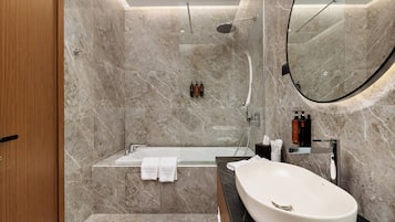 Combined shower/tub, eco-friendly toiletries, hair dryer, slippers