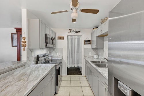 Spacious home with 7 beds, home gym, office with oversized backyard.
