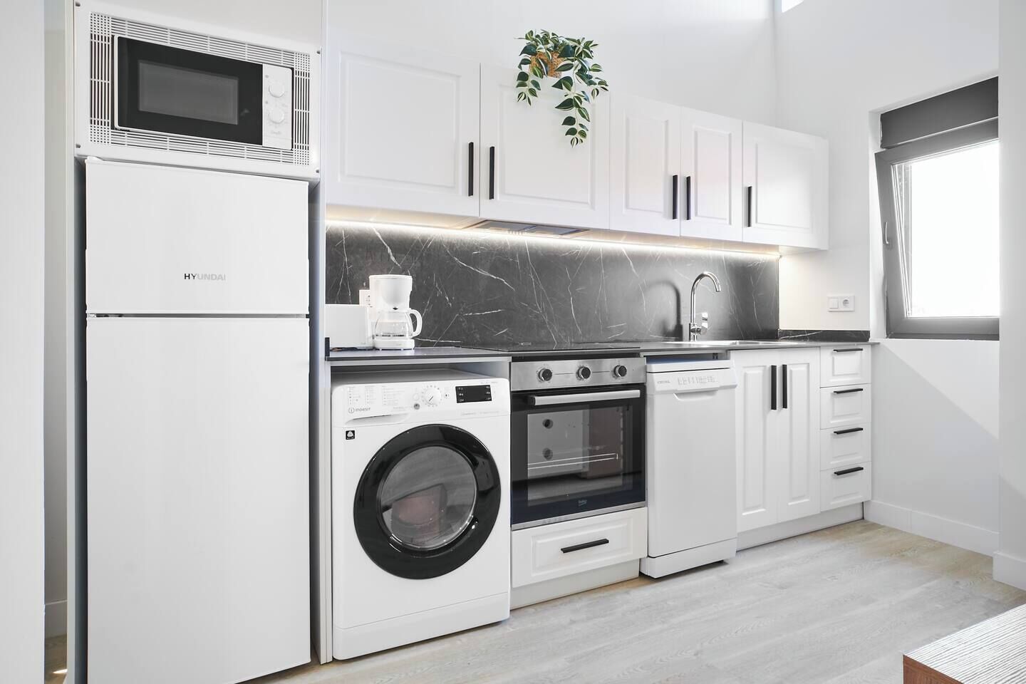 Coffee/tea maker, fridge, microwave, oven