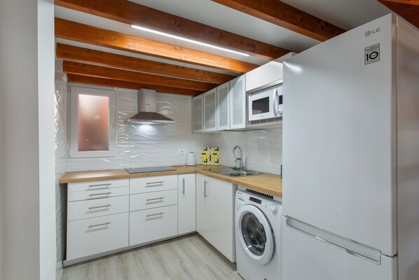 Fridge, microwave, stovetop, coffee/tea maker