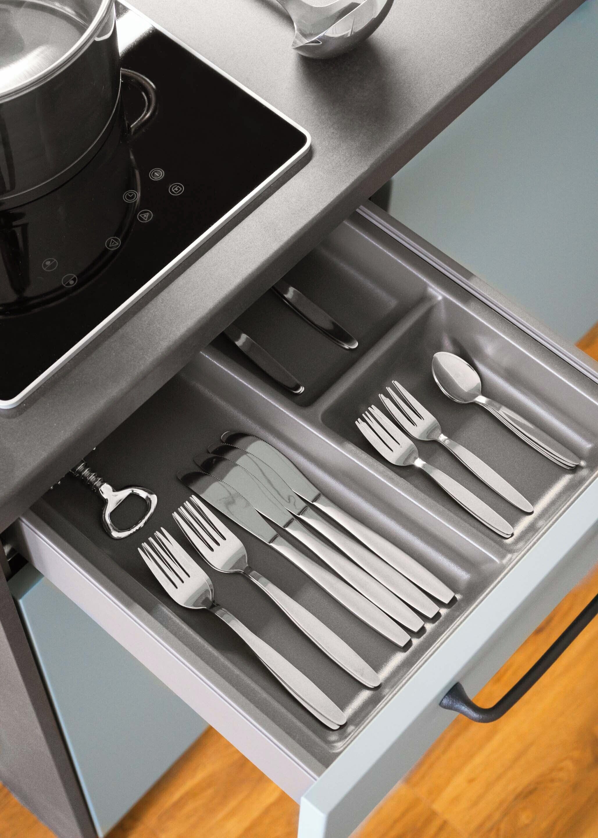 A kitchen drawer with utensils neatly organized.