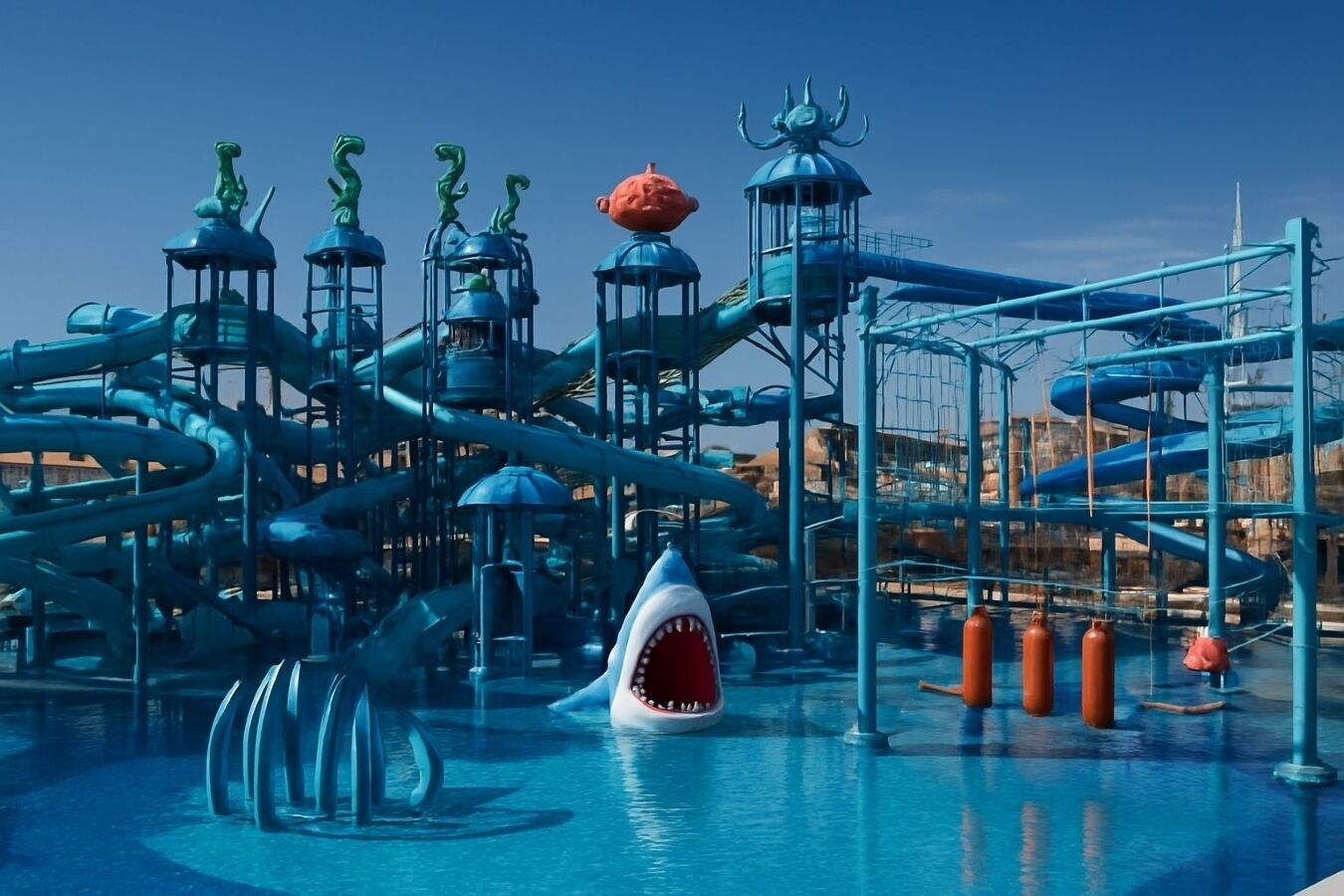 A water park with slides, a shark-themed pool, and various water features.