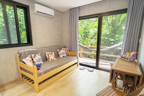 Standard Apartment, Balcony, Garden View | Living area | 40-inch Smart TV with digital channels, Netflix, streaming services