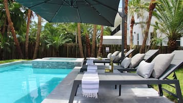 Outdoor pool, pool umbrellas, sun loungers