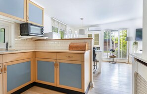 Fridge, stovetop, dishwasher, coffee/tea maker