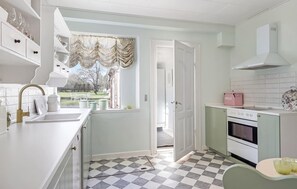 Fridge, stovetop, dishwasher, coffee/tea maker