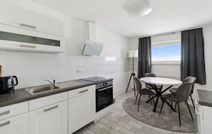 Fridge, stovetop, dishwasher, coffee/tea maker