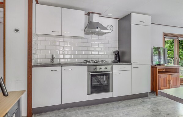 Fridge, stovetop, dishwasher, coffee/tea maker
