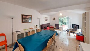 A spacious living area with a dining table, chairs, a sofa, and a TV. - Beautiful home in Jard-Sur-Mer with WiFi (Jard-Sur-Mer)