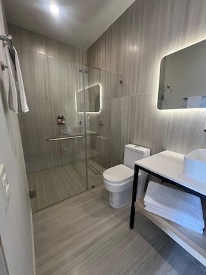 Bathtub, hair dryer, towels, soap