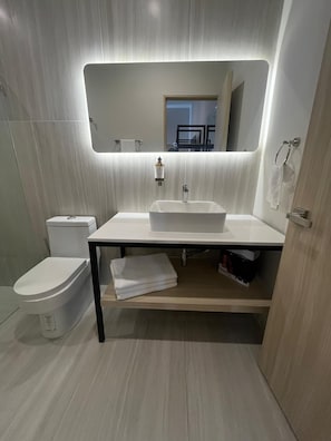 Bathtub, hair dryer, towels, soap