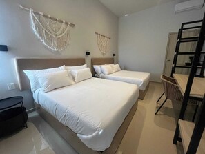 Desk, laptop workspace, blackout drapes, iron/ironing board