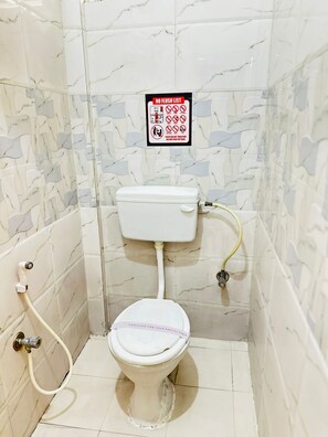 Deluxe Double Room, City View | Bathroom | Shower, free toiletries, hair dryer, towels - Hotel SM Comforts BTM Layout (Bengaluru)