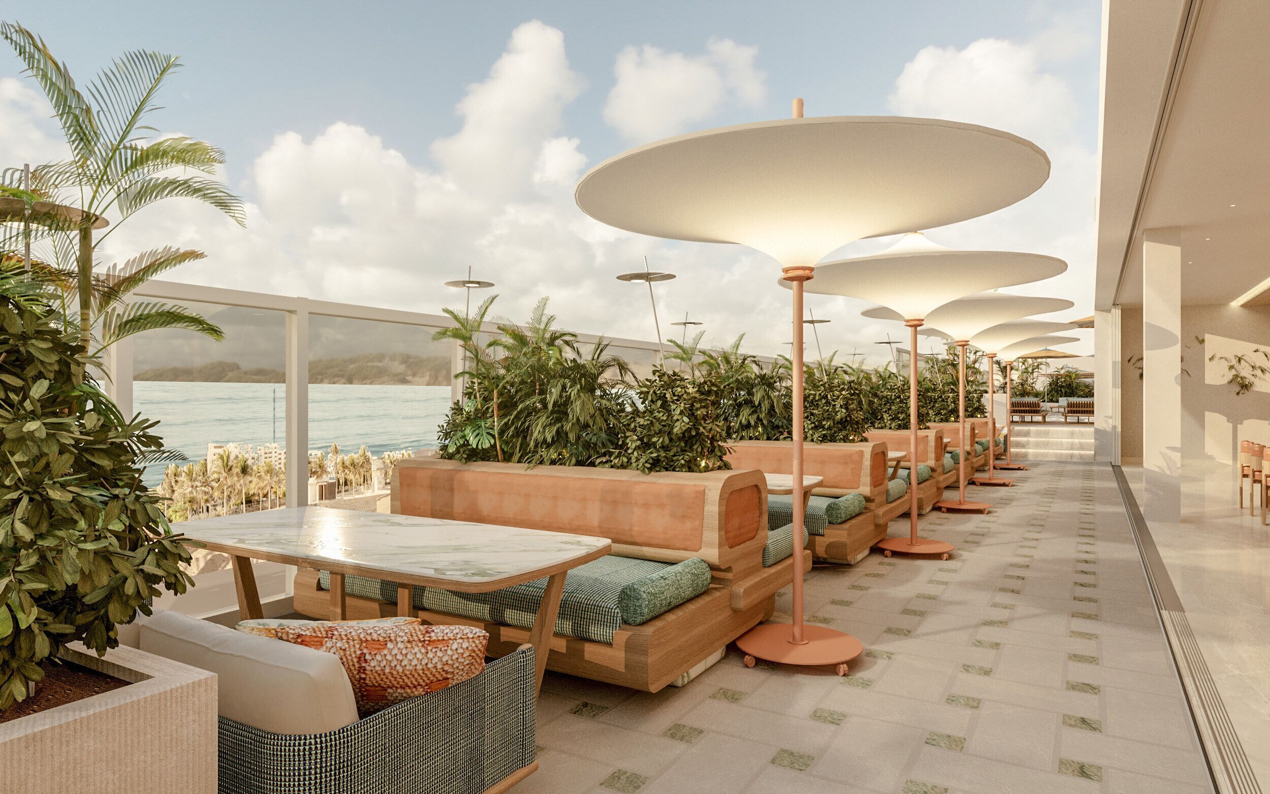 A modern outdoor seating area with tables and benches, large umbrellas, and lush greenery.