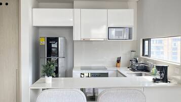 Basic Apartment | Private kitchen | Full-size fridge, microwave, oven, stovetop