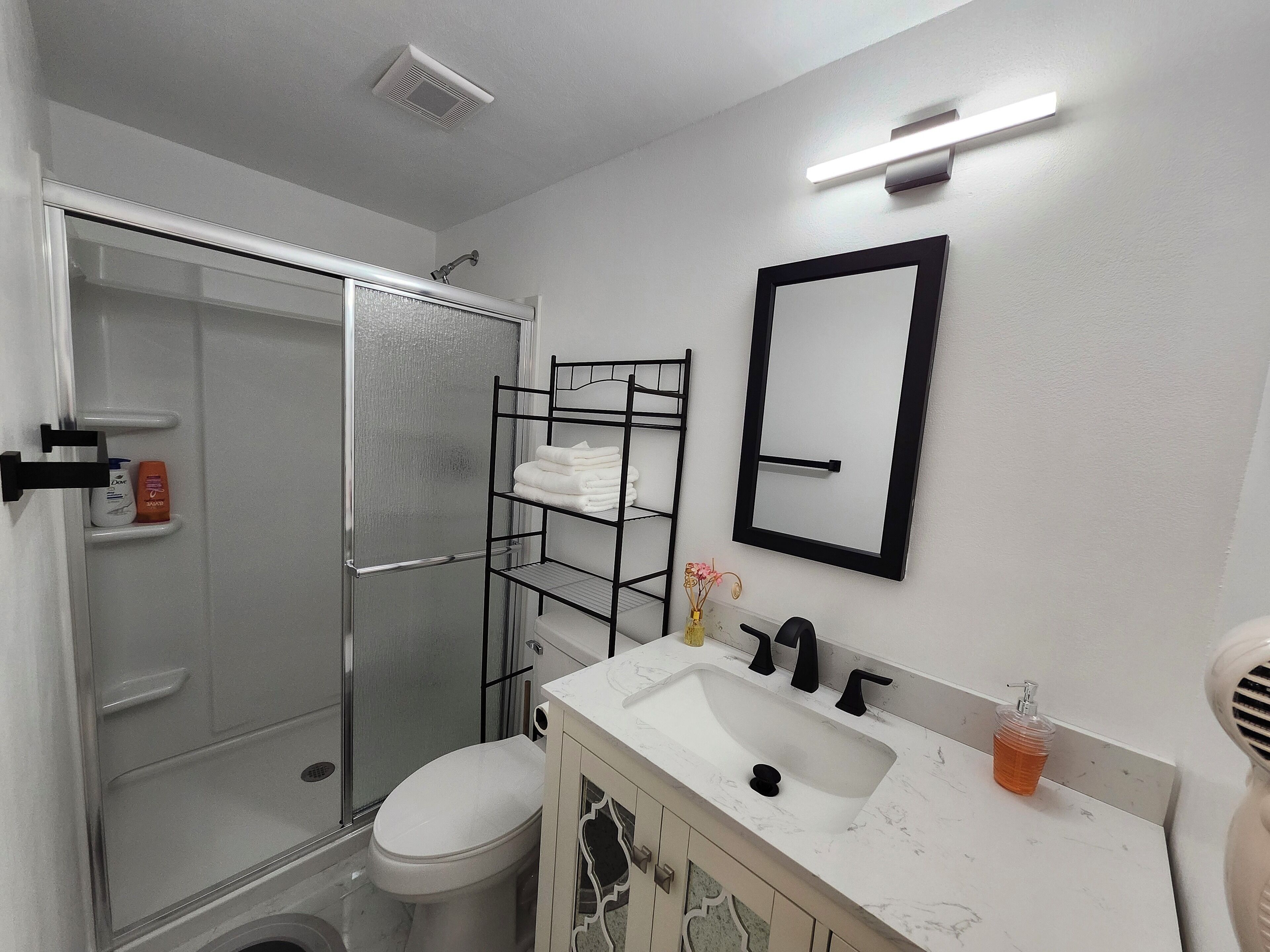 Shower, hair dryer, towels, soap