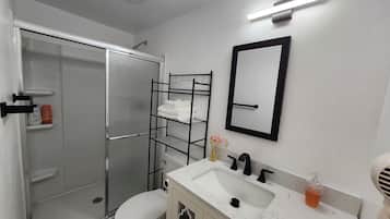 Shower, hair dryer, towels, soap