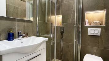 Shower, eco-friendly toiletries, hair dryer, towels