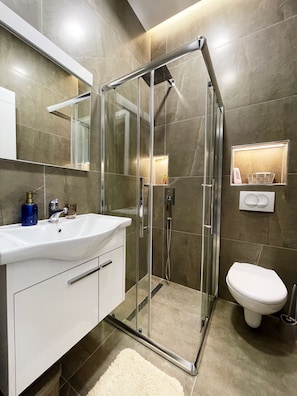 Shower, hair dryer, towels, soap