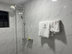 Shower, towels, soap, toilet paper