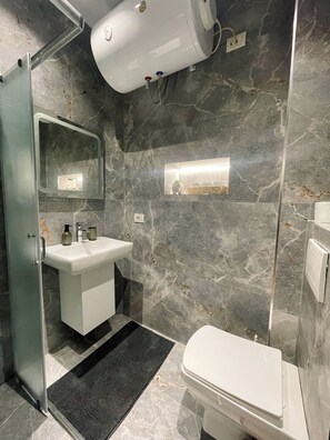 Shower, hair dryer, towels, soap