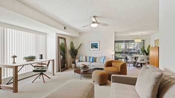 Condo, 1 King Bed with Sofa bed, Balcony, Pool View (Sunset Palmar) | Living area | 50-inch flat-screen TV with digital channels