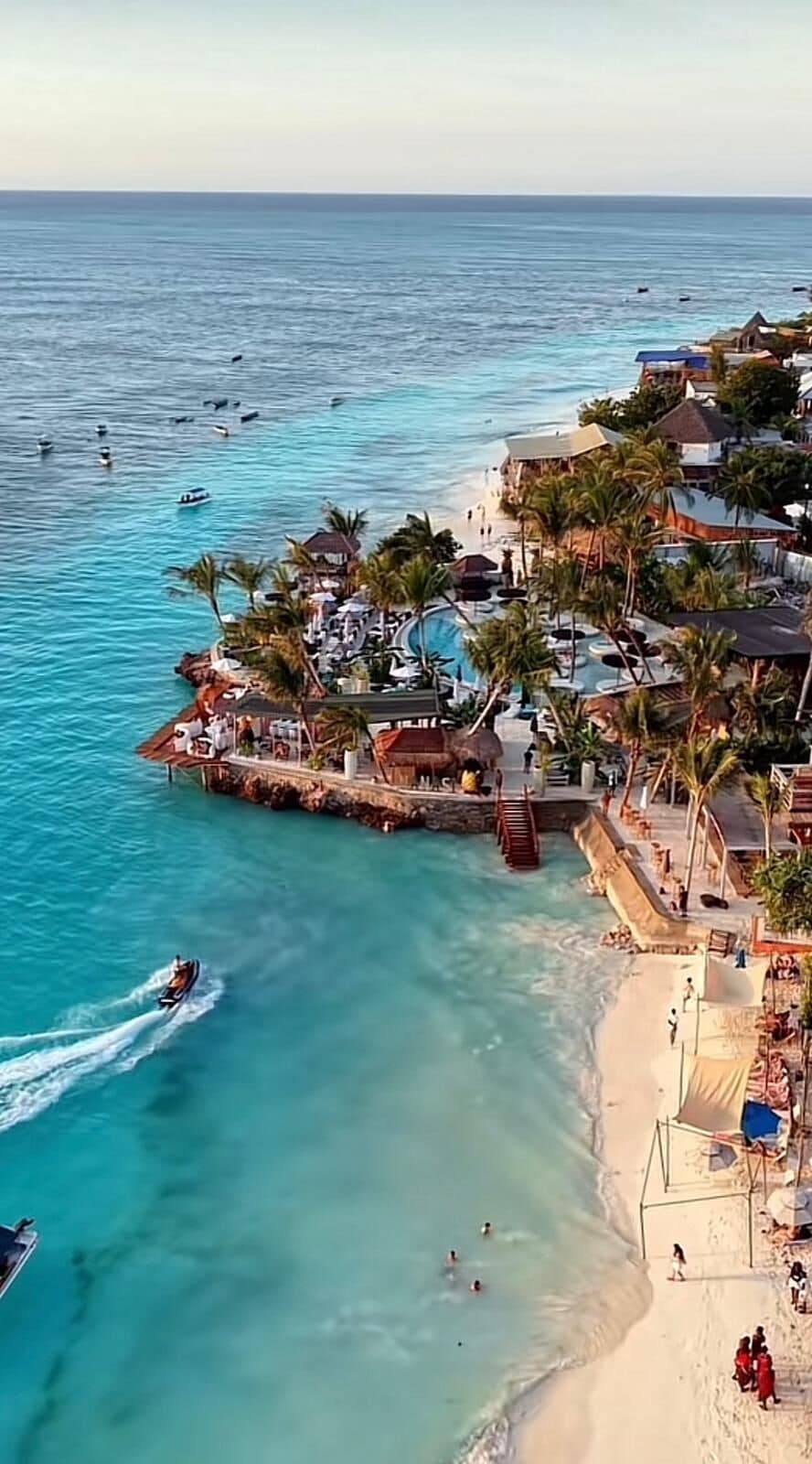 Beach nearby, white sand, beach towels