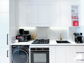 Microwave, coffee/tea maker, toaster, cookware/dishes/utensils