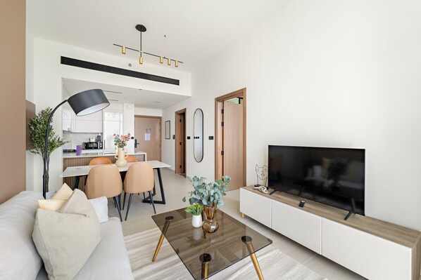 Deluxe Apartment | Living area | 50-inch Smart TV with digital channels