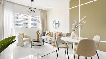 Business Apartment | Living area | 50-inch Smart TV with digital channels