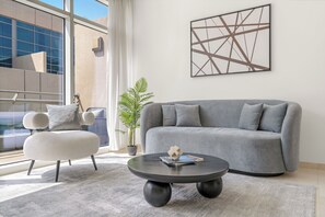 Exclusive Apartment | Living area | 50-inch Smart TV with digital channels, pay movies