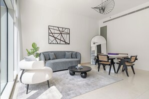 Exclusive Apartment | Living area | 50-inch Smart TV with digital channels, pay movies