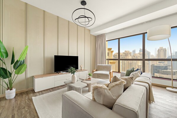 Standard Apartment | Living area | 50-inch Smart TV with digital channels