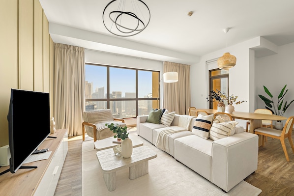 Standard Apartment | Living area | 50-inch Smart TV with digital channels