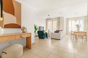 Elite Apartment | Living area | 50-inch Smart TV with digital channels