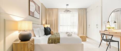 Elite Apartment | Egyptian cotton sheets, premium bedding, memory-foam beds, in-room safe