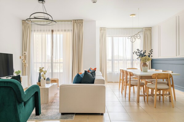 Elite Apartment | Living area | 50-inch Smart TV with digital channels