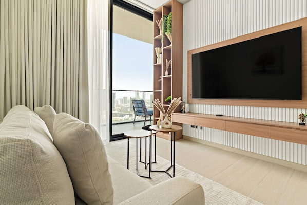 Signature Apartment | Living area | 50-inch Smart TV with digital channels