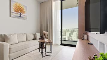 Signature Apartment | Living area | 50-inch Smart TV with digital channels