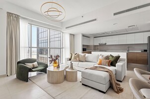 Deluxe Apartment | Living area | 50-inch Smart TV with digital channels