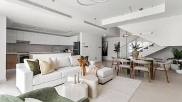 Deluxe Apartment | Living area | 50-inch Smart TV with digital channels