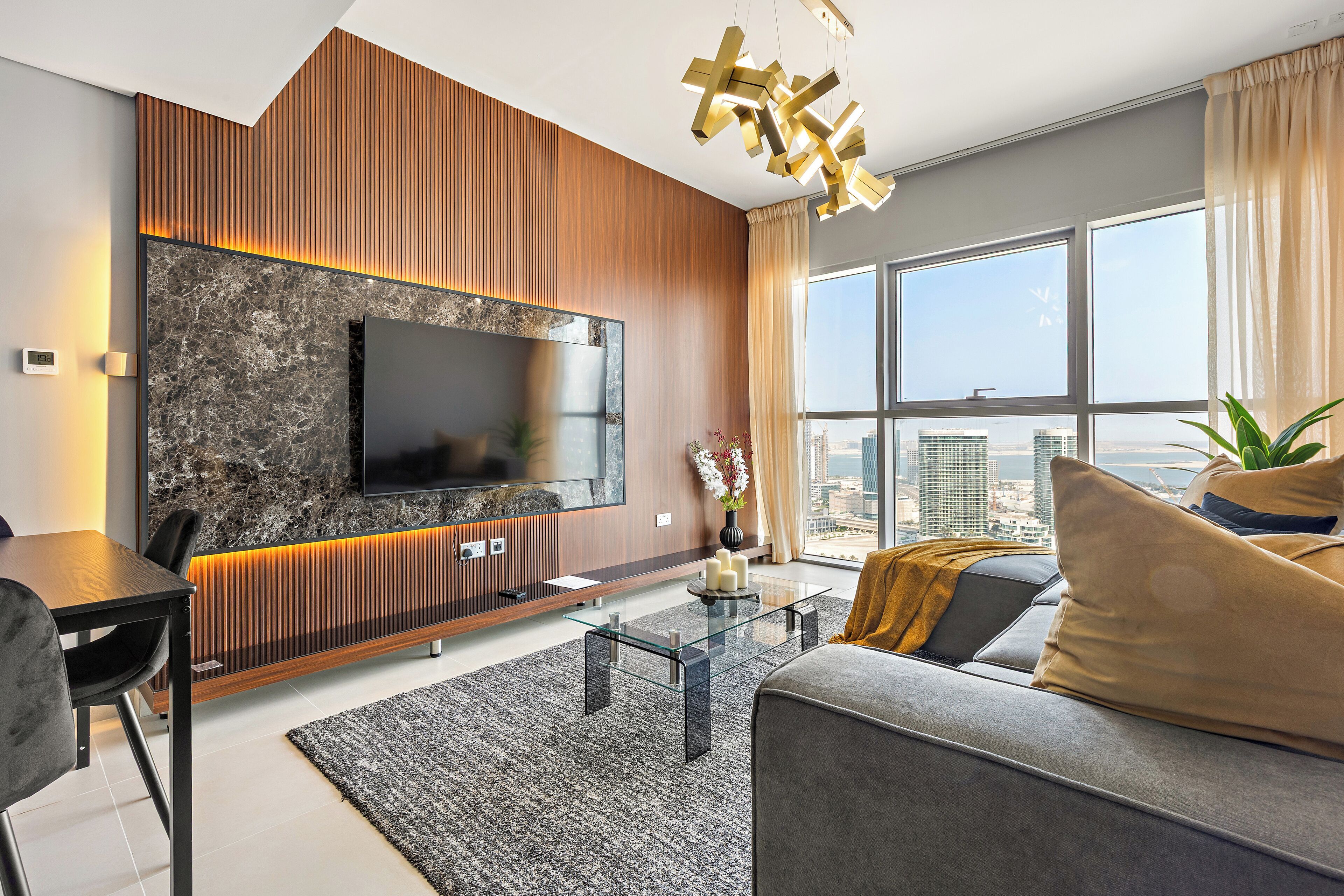 Standard Apartment | Living area | 50-inch Smart TV with digital channels