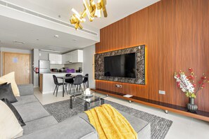 Standard Apartment | Living area | 50-inch Smart TV with digital channels - Silkhaus Radiant Boulevard (Abu Dhabi)