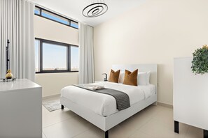 Superior Apartment | Living area | 50-inch Smart TV with digital channels - Silkhaus The View (Abu Dhabi)