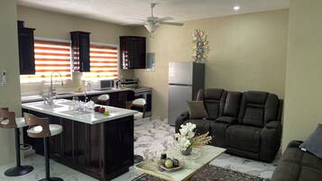 Deluxe Apartment, 3 Bedrooms, Private Pool, City View | Living area | Flat-screen TV