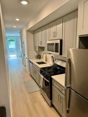 Fridge, microwave, oven, stovetop - Luxury Studio Apartment - 7 Min Walk NYC Train (Jersey City)