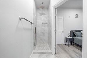 Shower, towels, soap, toilet paper