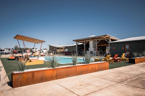 Cozy cabin with queen bed, full kitchen, and refreshing walk-in shower.