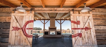 Cozy cabin with queen bed, full kitchen, and refreshing walk-in shower.