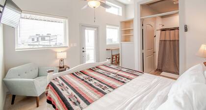 Cozy cabin with queen bed, full kitchen, and refreshing walk-in shower.